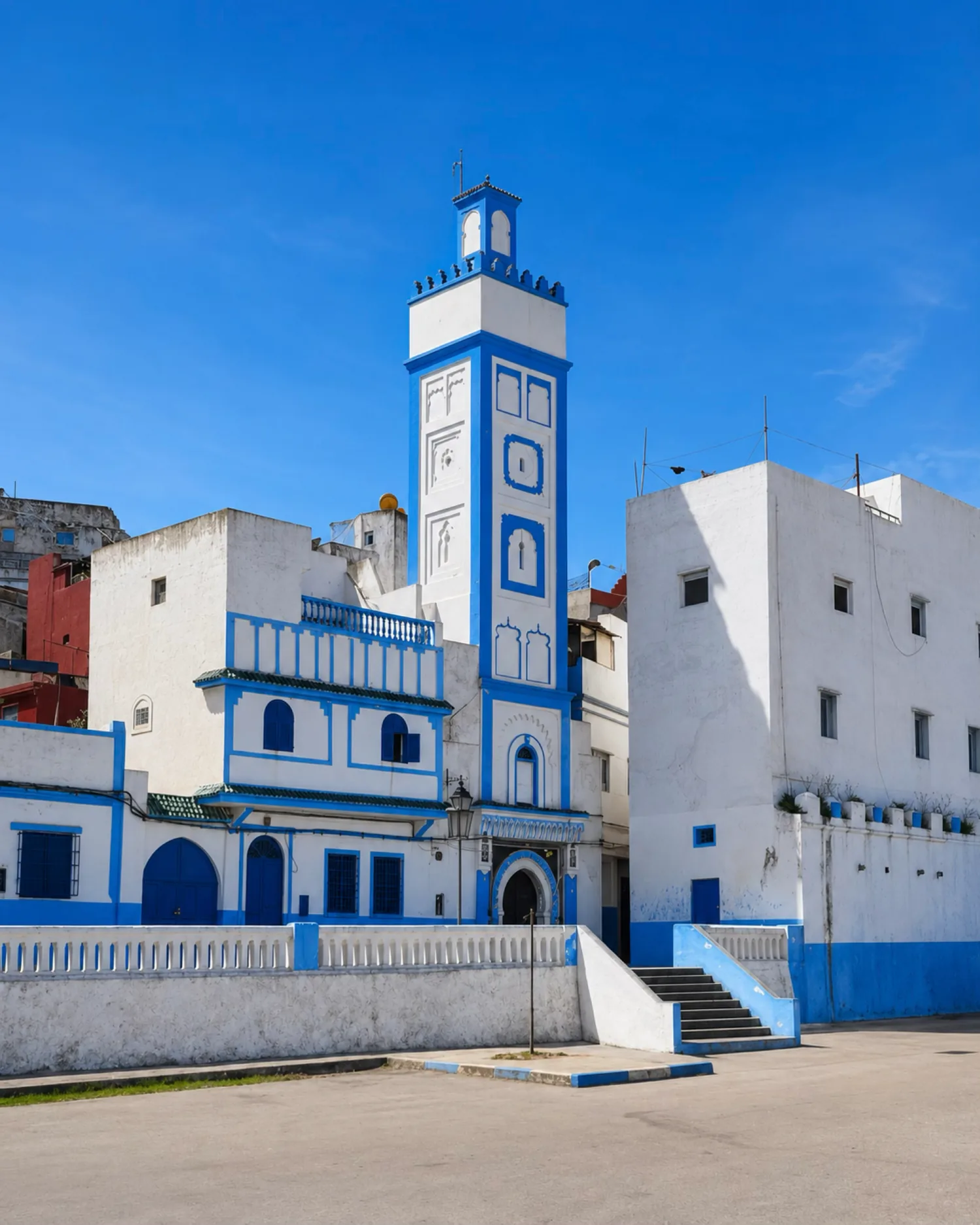 Blue minaret and white cityscape in Larache