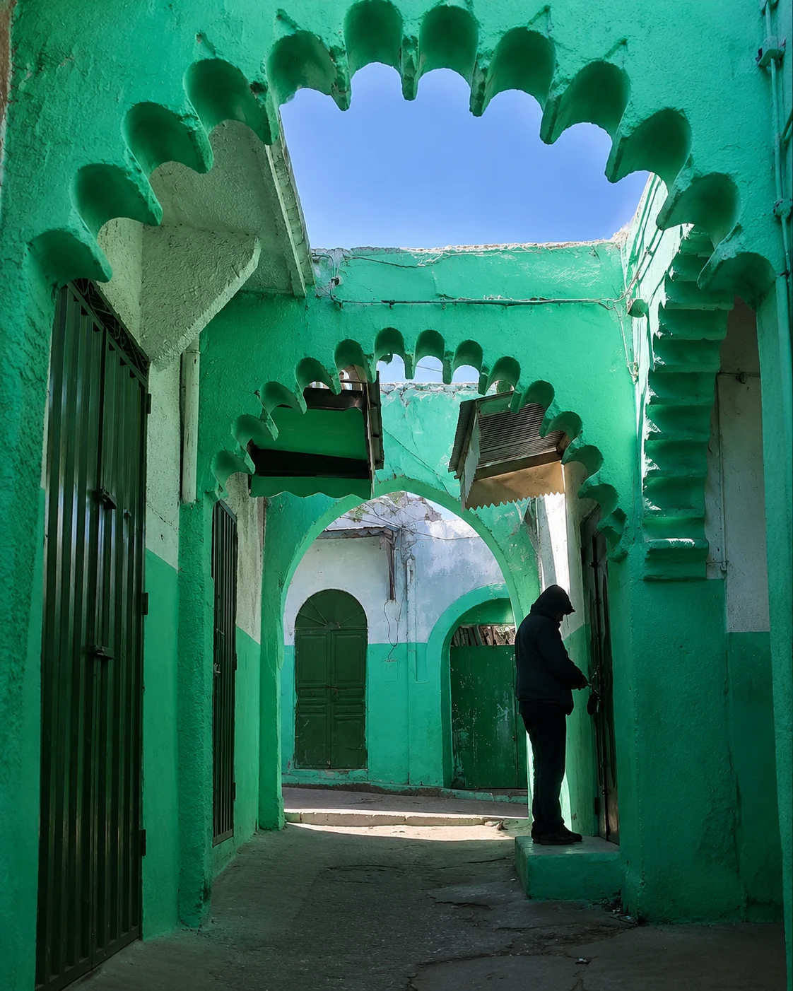 Turquoise arches and shaded passage in Ouazzane